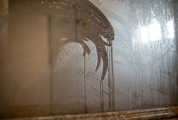 Bathroom mirror fogged with moisture from the shower.