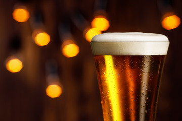 glass of beer with foam and bubbles