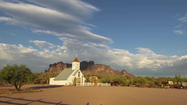 Sunset into Blue Hour with the Elvis Memorial Church and the Superstition Mountains in Arizona.