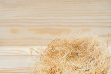 Haystack with copy space on wooden background