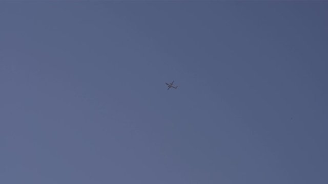 Bombardier airplane water bombing, firefighting air tanker in blue sky