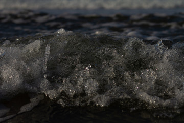 Waves breaking on a remote surf beach, New Zealand. 