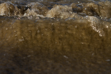 Waves breaking on a remote surf beach, New Zealand. 