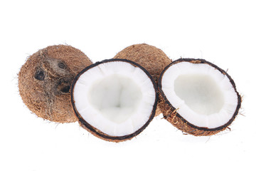 Fresh raw coconut with palm leaves isolated on white background. High resolution image