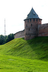 Obraz premium View to Metropolitan tower and wall of the Velikiy (Great) Novgorod citadel (kremlin, detinets) in Russia under blue summer sky in the morning