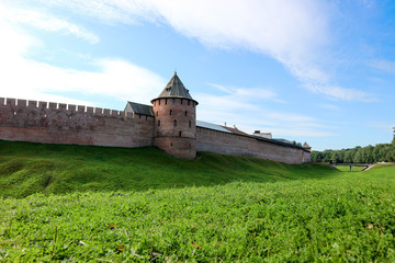 View to Metropolitan tower and wall of the Velikiy (Great) Novgorod citadel (kremlin, detinets) in Russia under blue summer sky in the morning