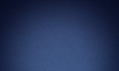 Texture of old navy blue paper closeup
