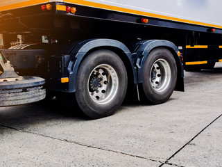 Freight container truck parking at loading dock for load shipment carton boxes and goods from warehouse cargo storage in logistics and transportation industrial