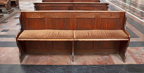 The grand interior of St. Vitus cathedral in Czech Republic, wooden church bench