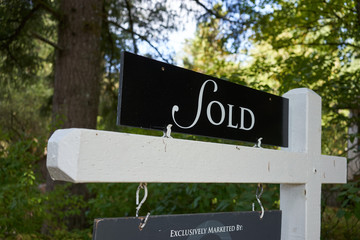 The Sold sign outside a residential property.