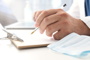 Doctor writing a medical receipt. Medical doctor consultation concept