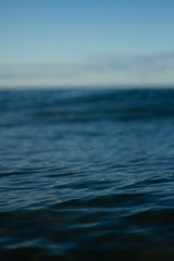 Small waves breaking on a surf beach, New Zealand. 