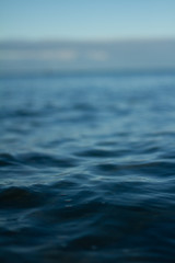 Small waves breaking on a surf beach, New Zealand. 
