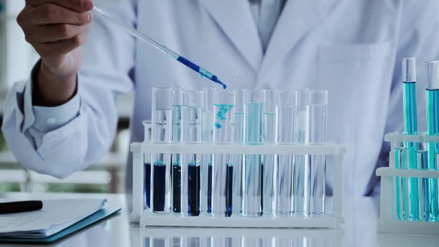 Scientist test for Covid-19 or Corona virus By using science tubes to research and treat illness cancer in lab or hospital. Medical treatment concept