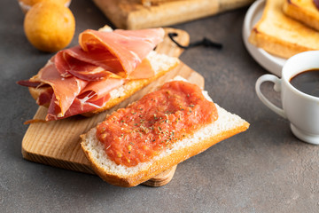 Spanish breakfast toasted bread with jamon (cured ham) and tomatoes for breakfast