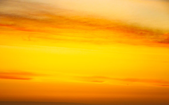 Yellow sky at sunrise or sunset