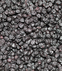 black fruits of dried blueberries
