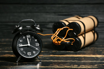 Bomb with clock timer on wooden background - obrazy, fototapety, plakaty
