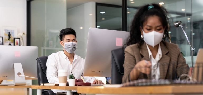 Asian employee face mask in new normal office
