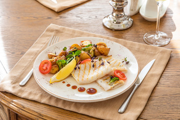 grilled squid with a side dish in the interior