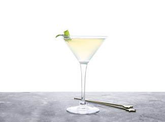Glass of fresh martini on table against white background