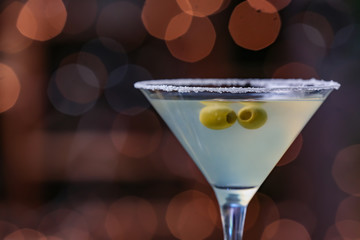 Glass of fresh martini on dark background, closeup