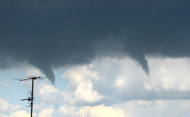 Two tornadoes close to each other. The one tornado preys on the energy of the other tornado, this is called a handover.