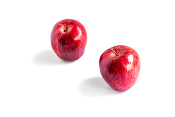 2 red apples set apart from the top corner and isolated on white background, red apples on a white background for product advertisements, space for text filling with Cut the route, with clipping path.