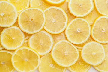 Slices of ripe lemon as background