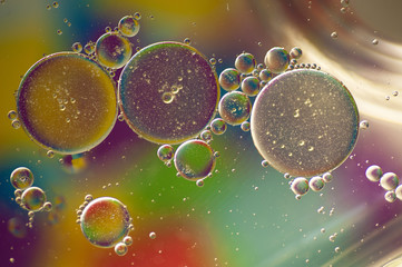 photo of multi-colored drops of oil close-up on a colored background for the background 3