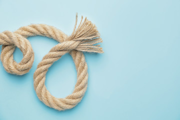 Long rope on color background