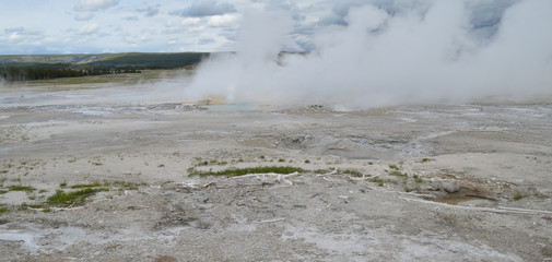 Late Spring in Yellowstone National Park: Clepsydra Geyser Erupts With Quiet Spasm Geyser in Foreground in the Fountain Group of Lower Geyser Basin