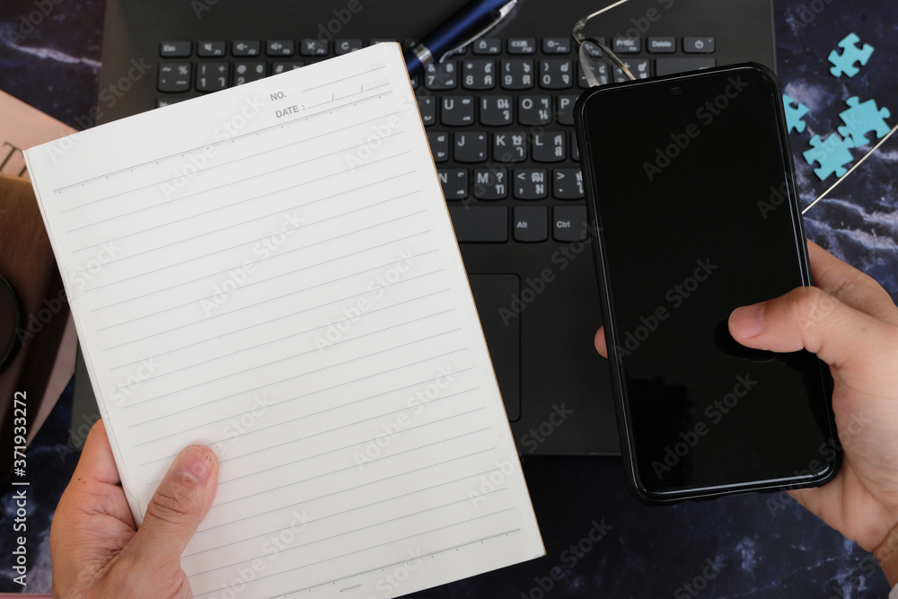 Poster businessman using a smartphone and working on the table