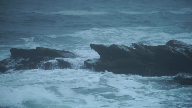 Coastal waves crashing on rocks