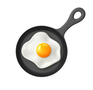 Fried egg in a frying pan isolated on white