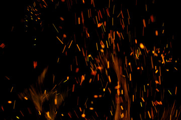 flame of fire with sparks on a black background