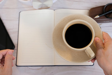 businessman holding a cup of coffee