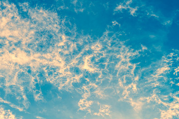 Fototapeta na wymiar Fluffy white clouds flying on blue sky background - Color filter effect style pictures