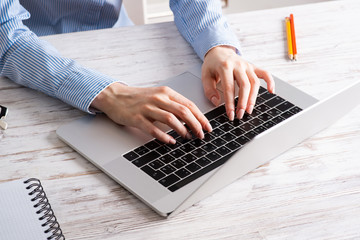 Fototapeta na wymiar Close up business woman hands working at laptop
