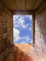 Think outside the box concept. Look through the frame. Look at the sky through the door