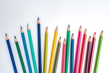close-up of color pencils on white background, Color pencils isolated on white background. Equality concept, The idea is to use colored pencils to book a comparison of inequality in society.
