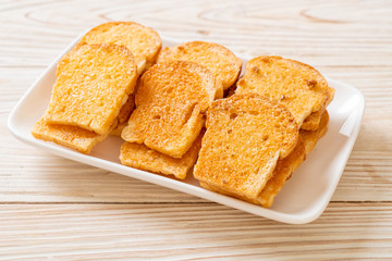baked crispy bread with butter and sugar