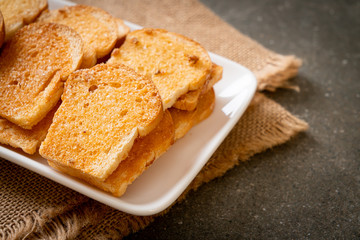 Fototapeta na wymiar baked crispy bread with butter and sugar
