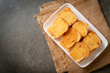 baked crispy bread with butter and sugar