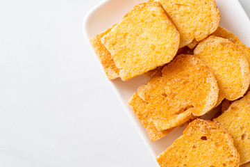 baked crispy bread with butter and sugar