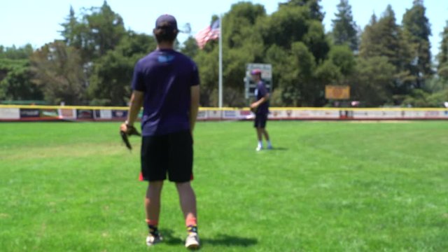 Two Friends Playing Catch With a Baseball