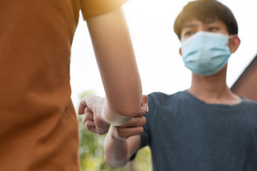Asian man and women shake hand no touching to protect corona virus concept new normal social...