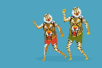 People with their body painted with tiger stripes dancing during the festival of Onam