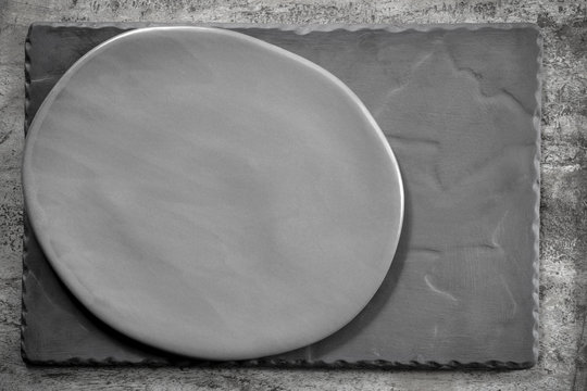 Rustic Oval Gray Plate over Slate Top View