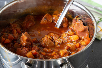 Italian Pork Ragout in a large  Pot . Isolated view